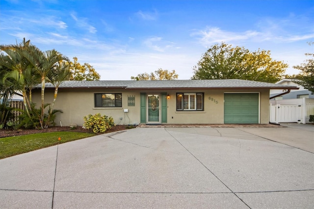 single story home featuring a garage