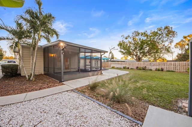 view of yard with a sunroom