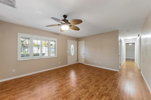 entrance foyer with ceiling fan and light hardwood / wood-style floors