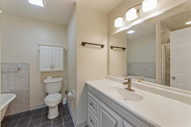 full bathroom with tile patterned floors, vanity, separate shower and tub, tile walls, and toilet