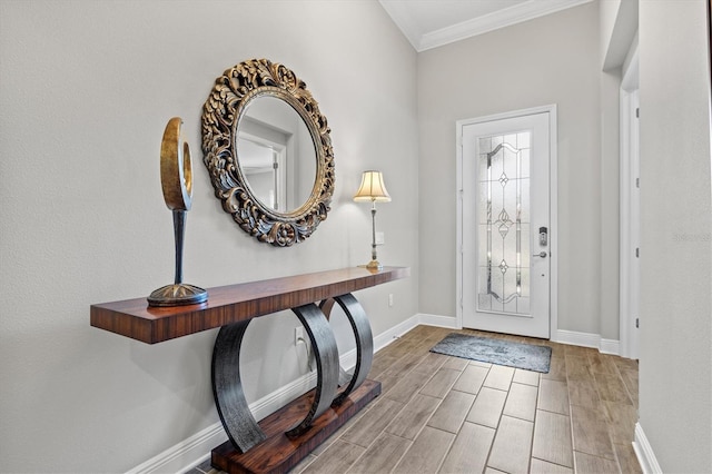 foyer featuring hardwood / wood-style flooring and ornamental molding