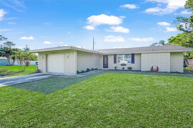 single story home with a garage and a front yard