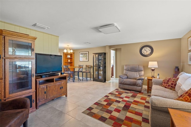584 Beverly Rd, Venice, FL 34293 - living area with light tile patterned floors and a chandelier