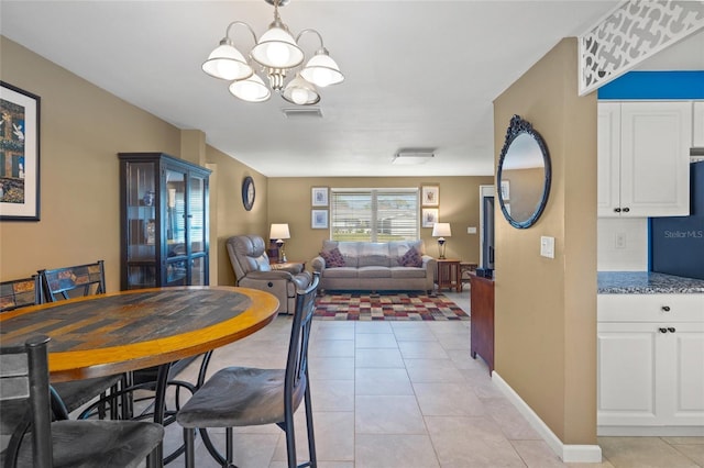 584 Beverly Rd, Venice, FL 34293 - dining space featuring a chandelier and light tile patterned floors