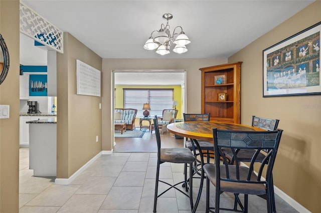 584 Beverly Rd, Venice, FL 34293 - dining area featuring a chandelier and light tile patterned flooring