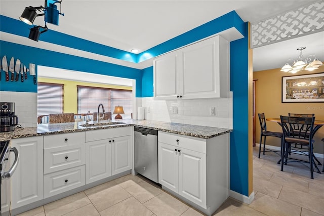 584 Beverly Rd, Venice, FL 34293 - kitchen with dishwasher, a chandelier, backsplash, and stone countertops