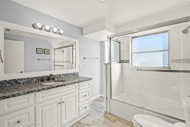 584 Beverly Rd, Venice, FL 34293 - full bath with shower / bath combination with glass door, vanity, and marble look tile flooring