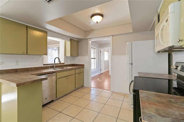 kitchen featuring sink, a healthy amount of sunlight, stainless steel dishwasher, and range