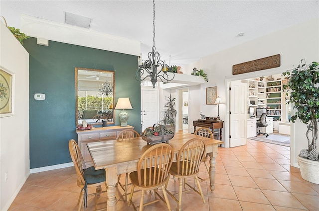 dining space featuring light tile patterned flooring, a textured ceiling, and a chandelier