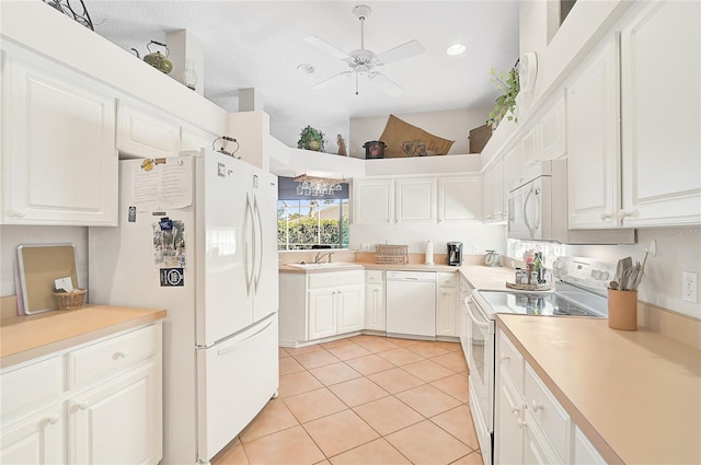 kitchen with white appliances, ceiling fan, sink, white cabinetry, and light tile patterned flooring