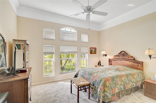 bedroom featuring light colored carpet, ceiling fan, and ornamental molding