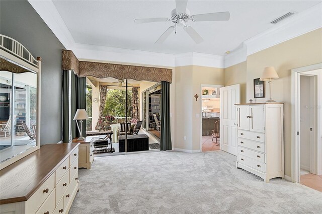 carpeted bedroom with access to outside, ceiling fan, and ornamental molding