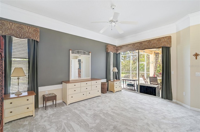 unfurnished bedroom featuring access to exterior, carpet flooring, ceiling fan, and ornamental molding