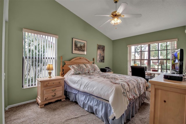 bedroom with ceiling fan, lofted ceiling, and light carpet