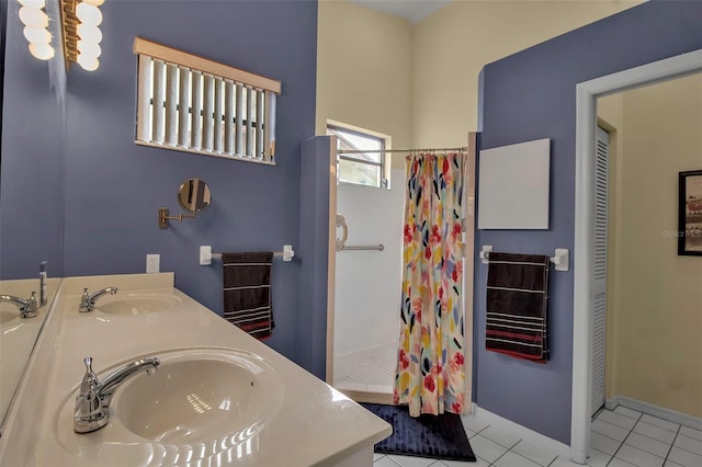 bathroom with vanity, tile patterned floors, and walk in shower