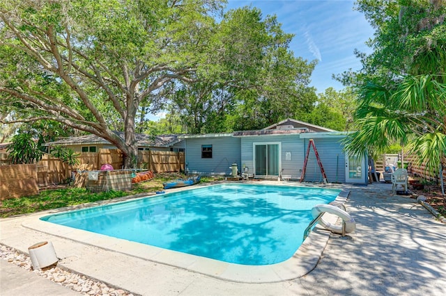 view of swimming pool with a patio area