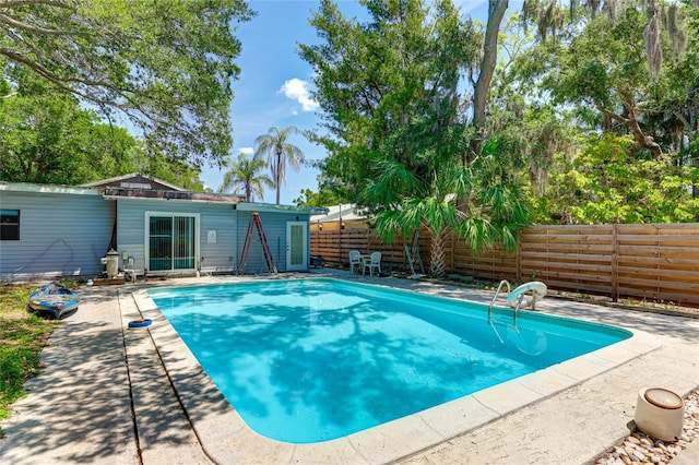 view of swimming pool with a patio area