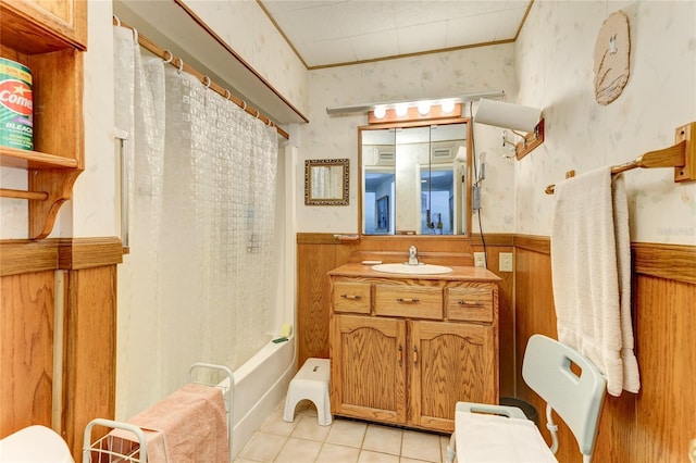 bathroom featuring tile patterned flooring, vanity, and shower / tub combo with curtain