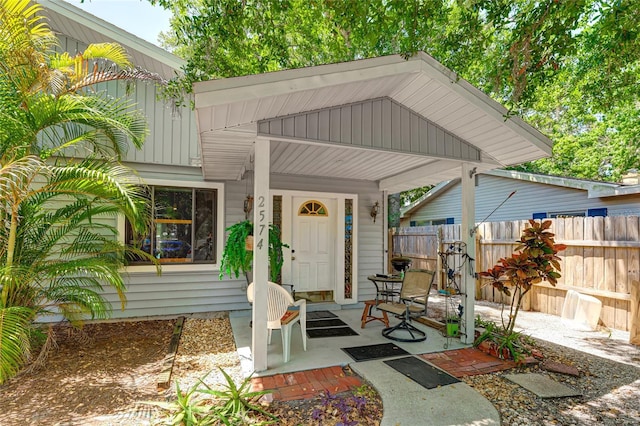 doorway to property featuring covered porch