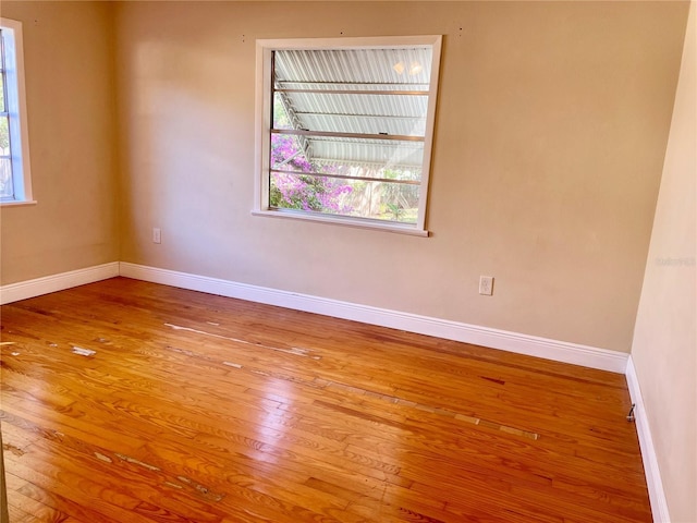 spare room featuring light hardwood / wood-style flooring