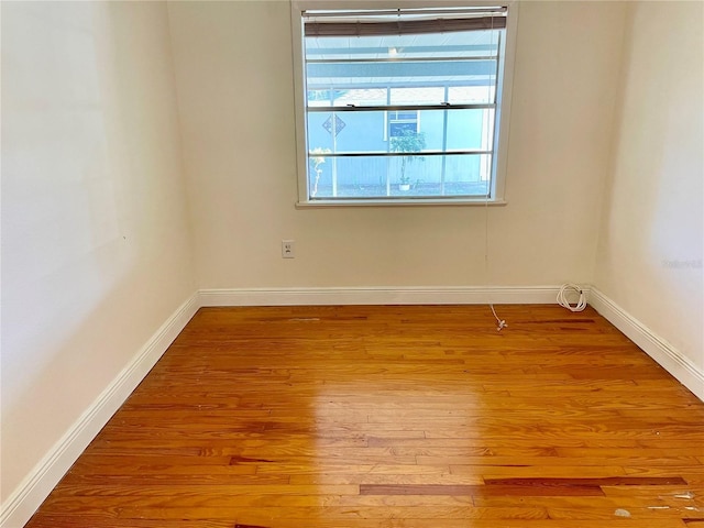 unfurnished room featuring light hardwood / wood-style floors