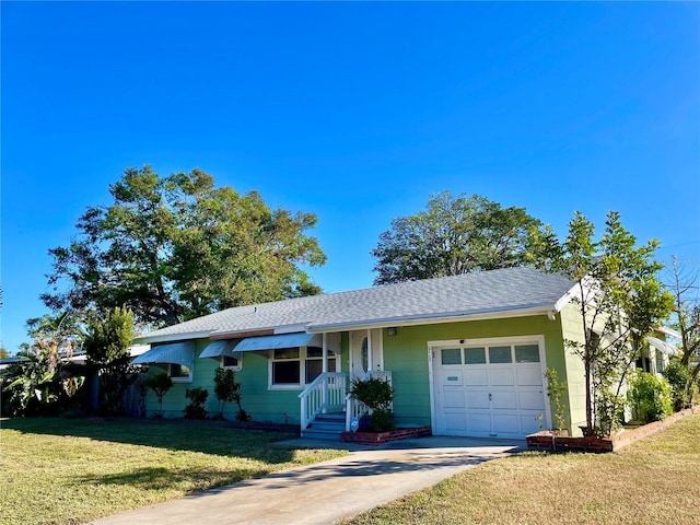 single story home featuring a front yard and a garage