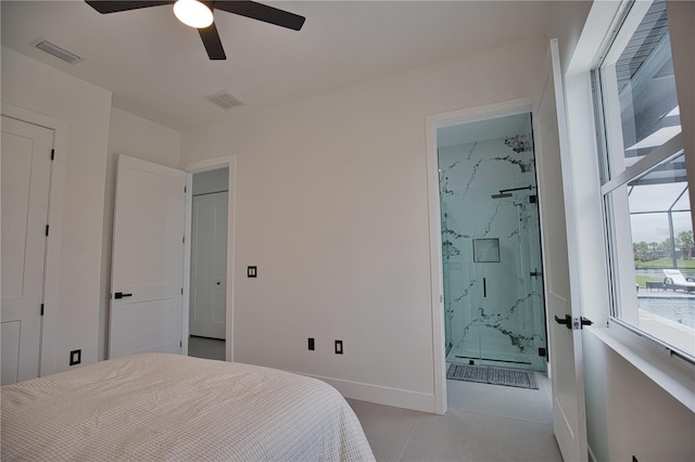 bedroom featuring ceiling fan and ensuite bath