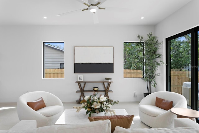 living area with ceiling fan