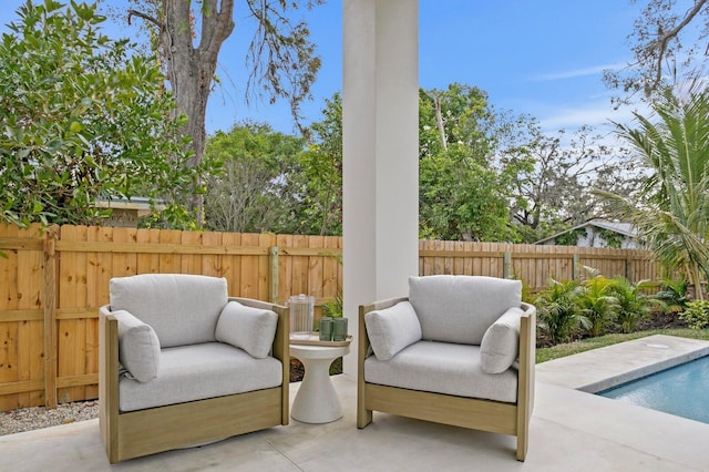 view of patio / terrace featuring a fenced in pool