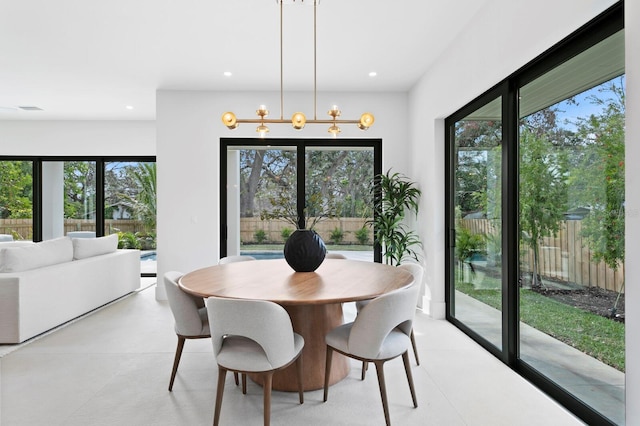 dining area featuring an inviting chandelier