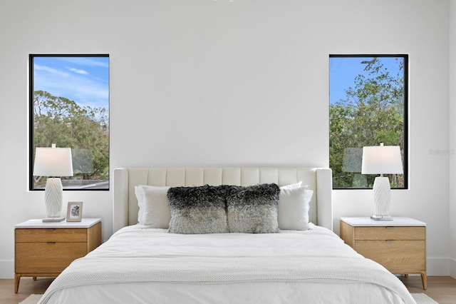 bedroom with light hardwood / wood-style floors