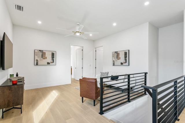 interior space with ceiling fan and light wood-type flooring