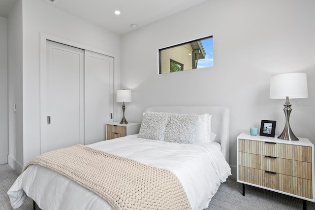 bedroom with carpet flooring and a closet