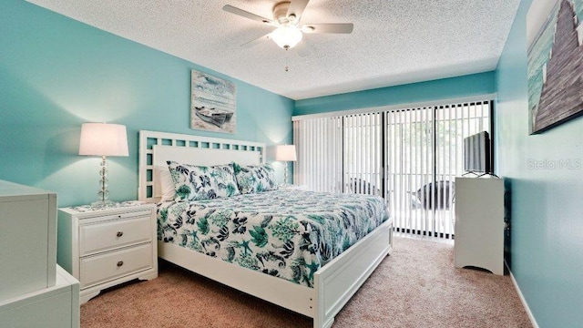 carpeted bedroom with access to exterior, ceiling fan, and a textured ceiling