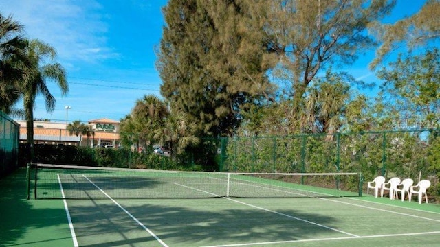 view of tennis court featuring basketball court