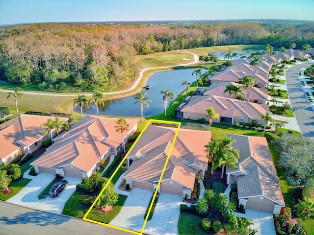 aerial view with a residential view, a water view, and a forest view