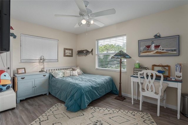 bedroom featuring ceiling fan and wood-type flooring