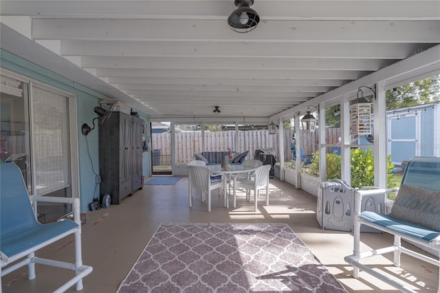 sunroom / solarium with beam ceiling