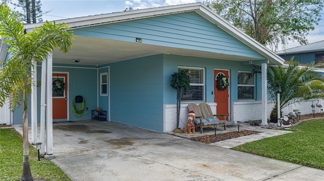 view of front of property featuring a carport