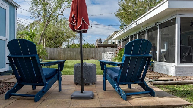 view of patio with a sunroom