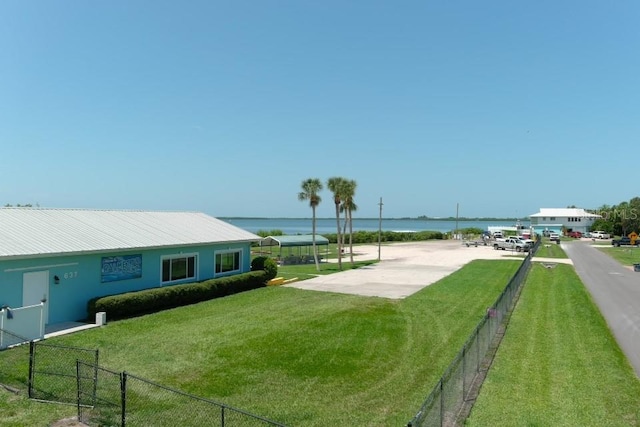 exterior space with a yard and a water view