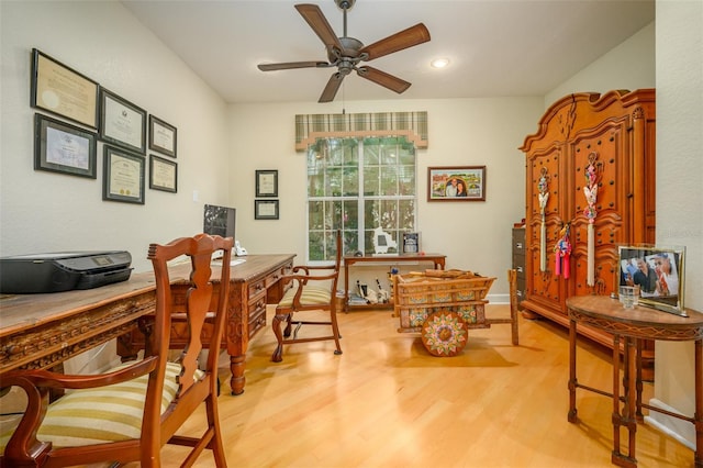 office featuring light wood-type flooring and ceiling fan