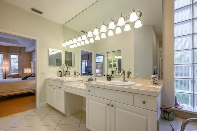 bathroom featuring tile patterned floors and vanity