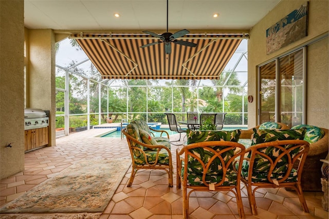 view of patio / terrace featuring a lanai, grilling area, and ceiling fan