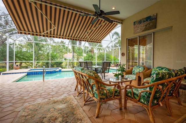 view of pool with an in ground hot tub, outdoor lounge area, a patio, and glass enclosure