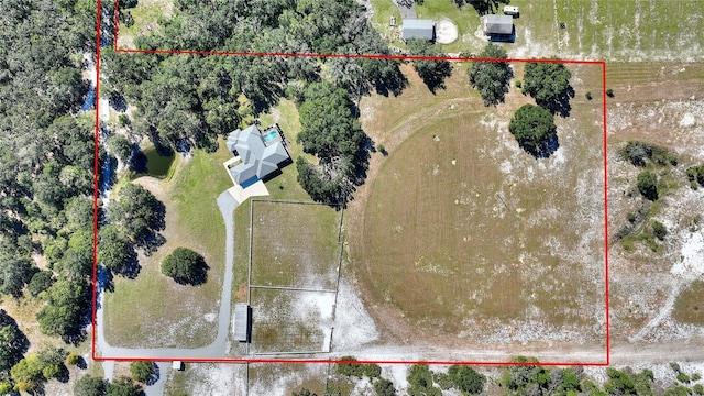 birds eye view of property featuring a rural view