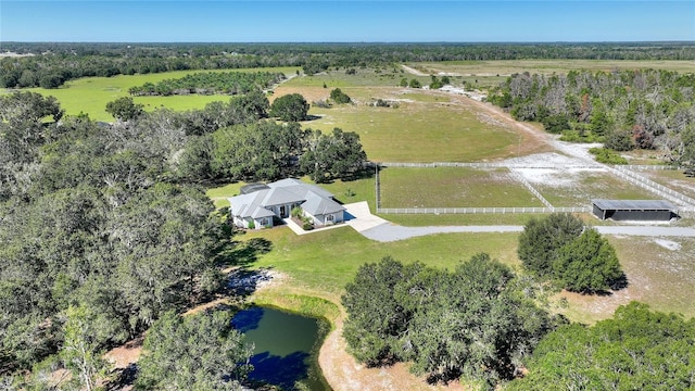 drone / aerial view featuring a water view and a rural view