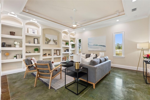 living room with a raised ceiling, crown molding, ceiling fan, and built in features