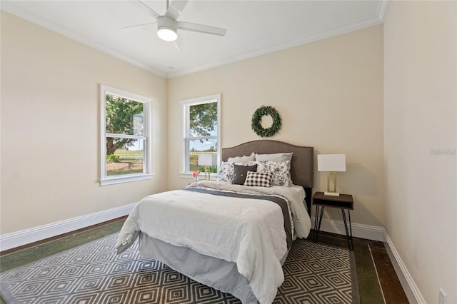 bedroom with ceiling fan, ornamental molding, and baseboards