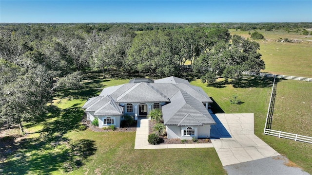 drone / aerial view featuring a view of trees